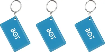 Three blue keychains with the word BOT printed on them.
