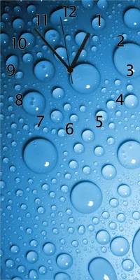 Produktbild von Wallario Design Wanduhr bedruckt, Größe 30 x 60 cm, Motiv: Wassertropfen auf Blau