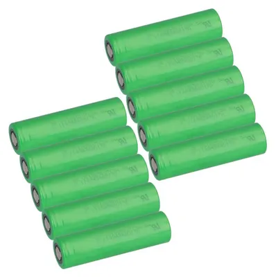 A group of green cylindrical batteries arranged in two stacks.
