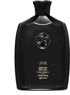A black bottle of Oribe Signature Shampoo.