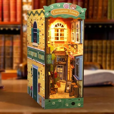 Produktbild von DIY Book Nook Katzenstadt - 3D-Puzzle - 136 Teile - Miniaturhaus aus Holz - mit LED-Licht