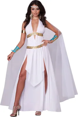 A woman modeling a white goddess costume with gold accents and a sheer cape.