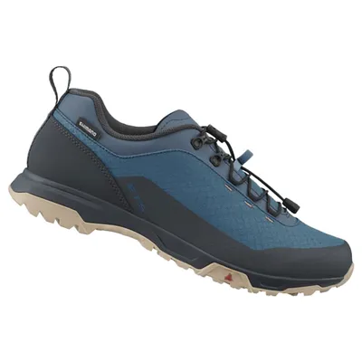 A single blue and gray cycling shoe is shown against a white background.