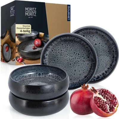 A set of four dessert bowls and a box are displayed with two pomegranates.
