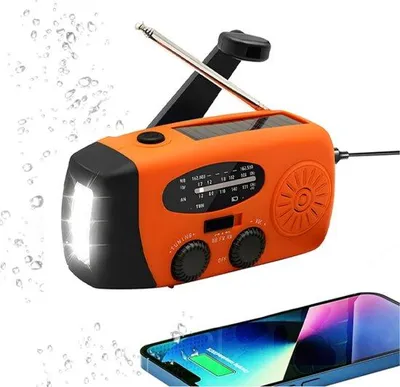 Immagine prodotto di Radio di emergenza - Radio di emergenza a manovella - 2000 mAh - Radio solare a manovella - Ricaricabile tramite USB e a batterie - Power bank - Solare - Torcia - Ideale per emergenze/campeggio - Manovella manuale - Arancione