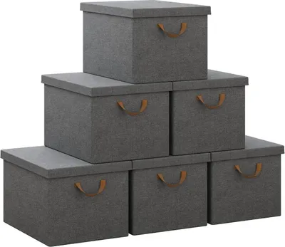 A stack of six grey storage boxes with brown handles, arranged in a pyramid shape against a white background.
