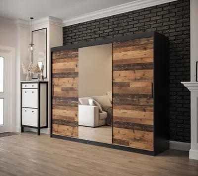 A bedroom or hallway setting with a large sliding door wardrobe.