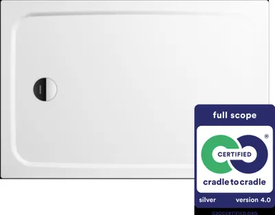 A white shower tray with a drain cover and a Cradle to Cradle certification badge.