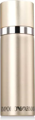A close-up studio shot of a gold-colored spray bottle with a silver band around the top.