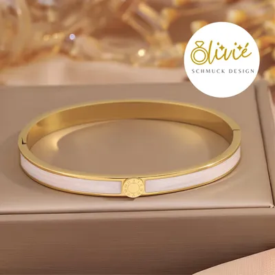 Produktbild von XCOAST Armreif aus Edelstahl – goldfarben mit fliederfarbenen Akzenten, öffn- und schließbar - perfektes Valentinstagsgeschenk