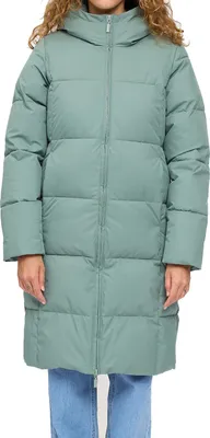 A woman wearing a long, green puffer jacket.