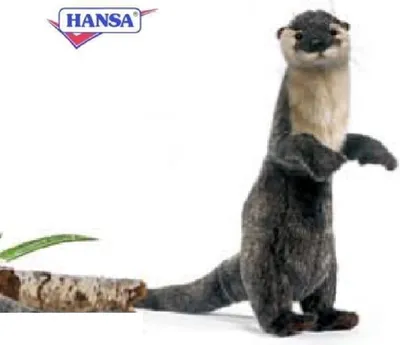 A stuffed otter toy standing on a white background next to a piece of wood.