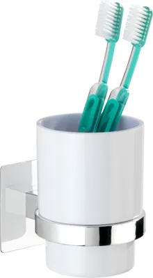 A toothbrush holder with two toothbrushes inside, mounted on a wall.