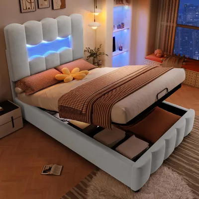 A bedroom scene with a bed that has storage underneath and LED lighting.