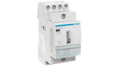 A white electrical contactor mounted on a DIN rail.