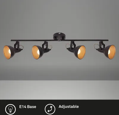 A black track light fixture with four adjustable spotlights against a plain gray background.