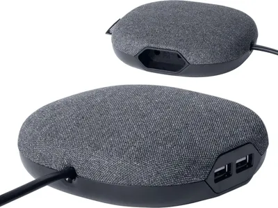 Two views of a fabric-covered charging station with USB ports and an outlet.