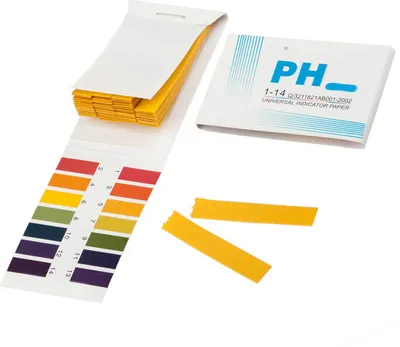 A set of pH indicator strips and their packaging.