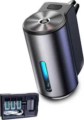 A car air freshener with a charging cable and essential oil bottles.