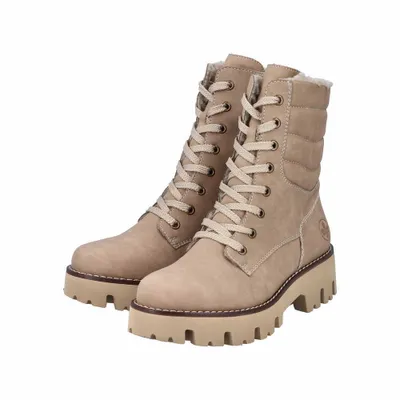 A pair of beige lace-up boots on a white background.