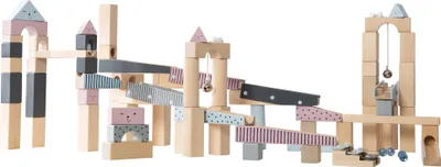 A wooden marble run construction set with various ramps, towers, and accessories.