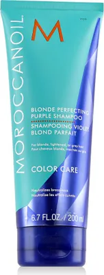 A tube of Moroccanoil Blonde Perfecting Purple Shampoo against a white background.