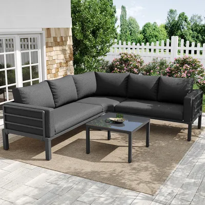 Image de Ensemble de mobilier de jardin Zerboco, pour 4 à 5 personnes, 1 table basse avec plateau en verre, structure en fer galvanisé, coussins d'assise inclus, pieds réglables