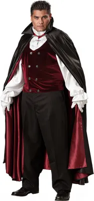 A man dressed in a vampire costume, standing against a white background.