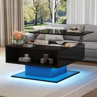 A modern black high-gloss coffee table with a lift-top and integrated blue LED lighting, placed in a living room setting with a sofa and curtains in the background.