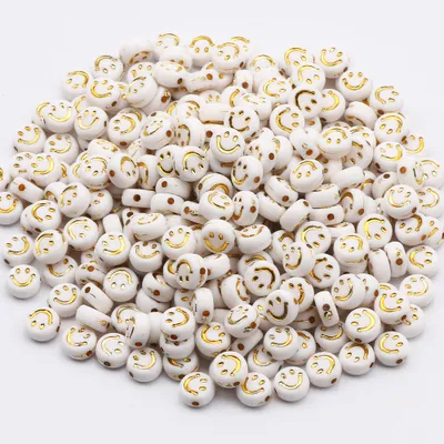 Produktbild von Bastelperlen rund 100 Stück, 7 x 4 mm rund, weiße Perlen mit goldfarbigem Smiley