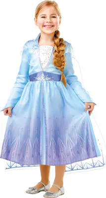 A young girl wearing a blue Elsa costume from Frozen 2, posing against a white background.