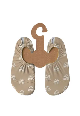A pair of baby shoes with a rainbow pattern, attached to a cardboard hanger.