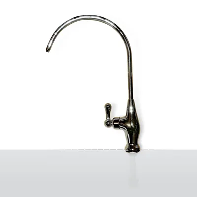 A chrome faucet with a curved spout and a lever handle, isolated on a white background with a light gray surface below.
