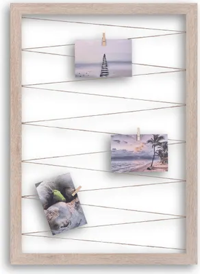 A collage of three photos clipped to a wooden frame with jute strings.