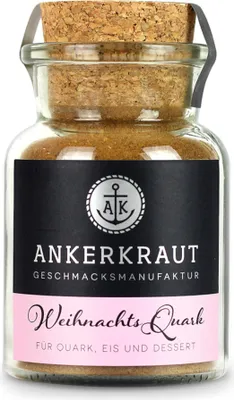 A glass jar of spice blend with a cork lid, set against a white background.