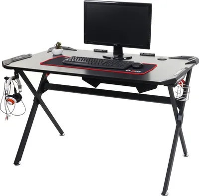 A gaming desk with a computer monitor, keyboard, mouse, and headphones.