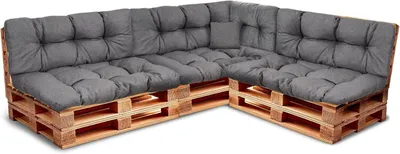 A sectional sofa made from wooden pallets with dark gray cushions, shown against a white background.