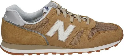 A side view of a New Balance 373 sneaker.