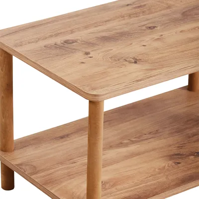 A close-up view of a two-tiered wooden coffee table.