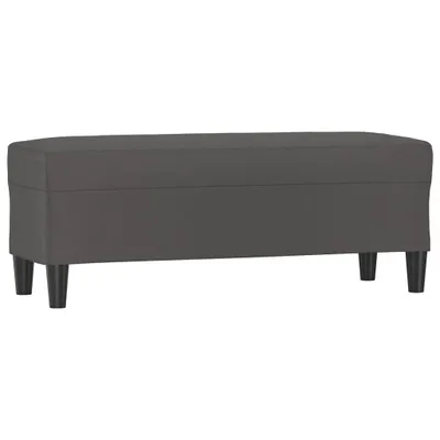 A studio shot of a gray bench on a white background.