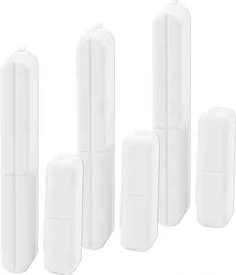 A group of white door/window contact sensors arranged on a white background.