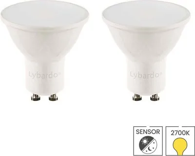 Two white LED light bulbs are shown against a white background. Below the bulbs are two icons indicating a sensor and color temperature.