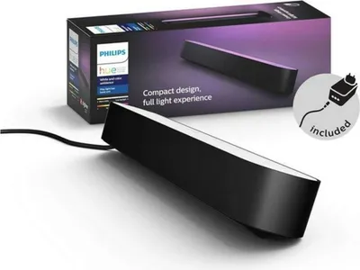 A black Philips Hue Play LED light bar is shown in front of its packaging.