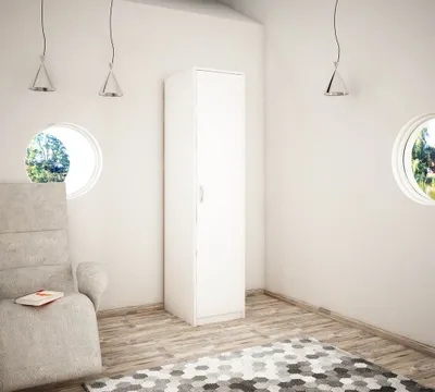 A minimalist room with a white wardrobe, a chair, and two circular windows.