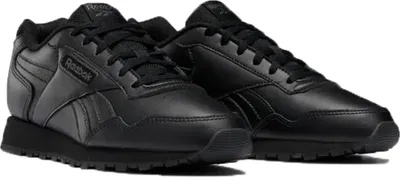 A pair of black Reebok sneakers.
