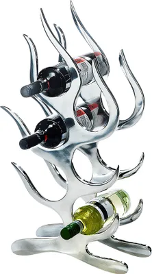 A silver-colored wine rack holding several bottles of wine against a white background.