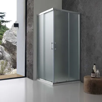 A modern bathroom with a frosted glass shower enclosure.