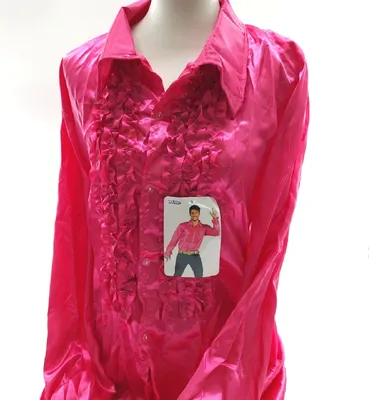 A pink ruffled shirt displayed on a mannequin.