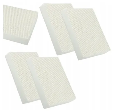 Several white rectangular filters with a textured surface are arranged on a white background.