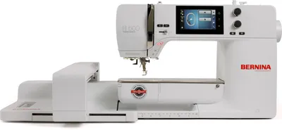 A white Bernina B 500 sewing machine with an embroidery module attached, shown from the front-left.